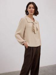 BGN Bluzka w kolorze beżowym rozmiar: 38. Brązowe bluzki damskie BGN, bez wzorów, bez kołnierzyka, bez ramiączek. Za 127.05 zł.