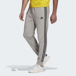 Spodnie męskie adidas ESSENTIALS 3-STRIPES. Czarne spodnie sportowe męskie Adidas. Za 182.00 zł.