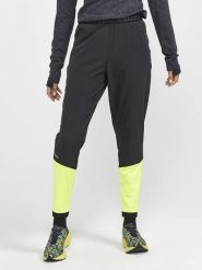 Craft Spodnie sportowe "ADV Essential" w kolorze czarno-żółtym rozmiar: XL. Czarne spodnie sportowe damskie Craft, xl, z materiału, outdoorowe. Za 149.95 zł.