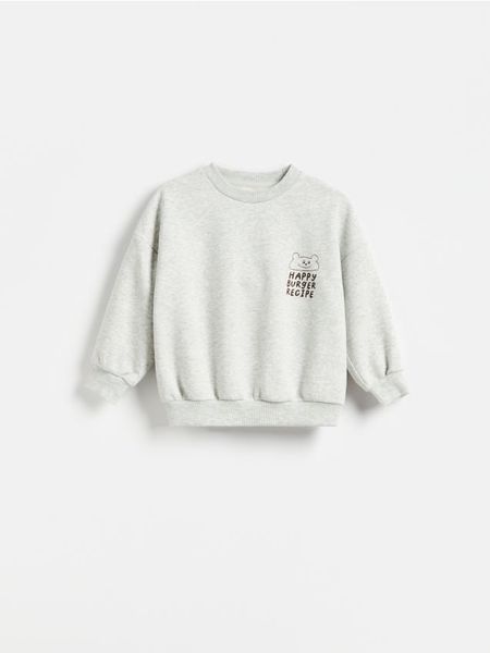 Bluza z nadrukiem - jasnoszary. Szare bluzy i bluzki niemowlęce Reserved, bez wzorów, z bawełny, bez ramiączek, bez kaptura. Za 49.99 zł.