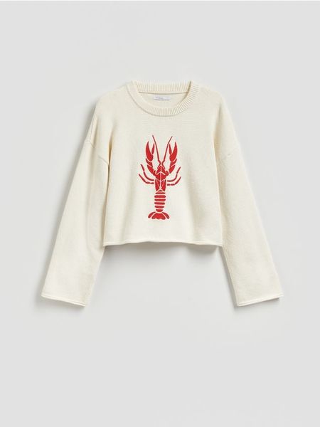 Sweter z haftem - kremowy. Białe swetry klasyczne damskie Reserved, l, z bawełny, bez kołnierzyka. Za 139.99 zł.