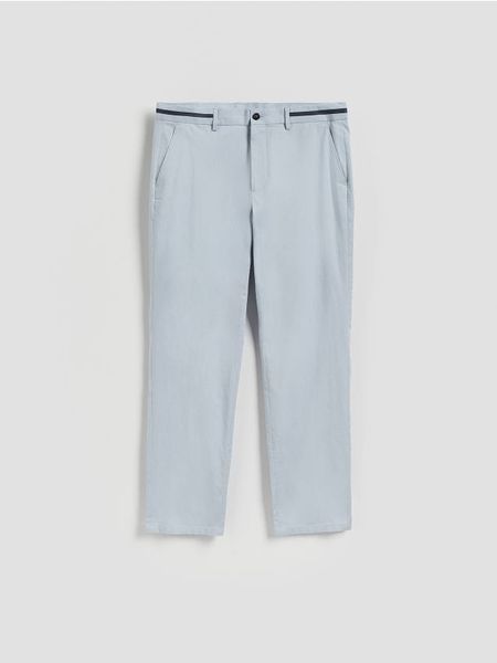 Spodnie slim z domieszką wełny - jasnoniebieski. Niebieskie spodnie materiałowe męskie Reserved, bez wzorów, z bawełny. Za 149.99 zł.