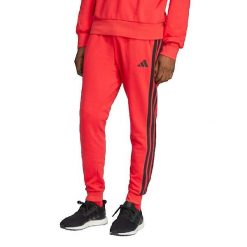 Spodnie Mężczyzna Adidas Essential 3 Stripes czerwony. Czerwone spodnie dresowe męskie Adidas, bez wzorów, z dresówki. Za 211.95 zł.