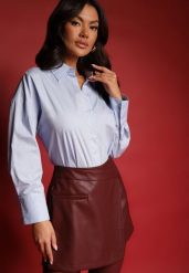 Jasnoniebieska Casualowa Koszula z Bawełny Naliraella. Niebieskie koszule damskie Renee, l, bez wzorów, z bawełny, biznesowe, bez kołnierzyka, bez ramiączek. Za 59.99 zł.