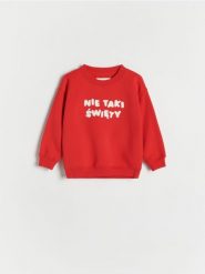 Świąteczna bluza - czerwony. Czerwone bluzy i bluzki niemowlęce Reserved, bez wzorów, z bawełny, bez ramiączek, bez kaptura. W wyprzedaży za 25.99 zł.