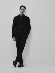 Spodnie garniturowe slim fit - czarny. Czarne spodnie wizytowe męskie Reserved, z tkaniny. Za 159.99 zł.