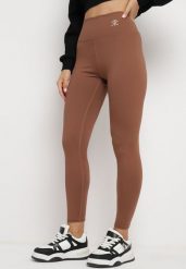 Brązowe Legginsy Sportowe z Wysokim Stanem i Drobnym Nadrukiem Leridra. Brązowe legginsy damskie Born2be, l, bez wzorów, z jeansu. Za 29.99 zł.