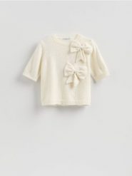 Sweter z kokardami - kremowy. Białe swetry klasyczne damskie Reserved, l, z dzianiny, bez kołnierzyka. Za 129.99 zł.