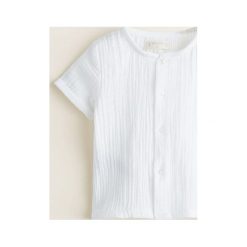 Mango Kids - Koszulka dziecięca Jaqui 62-80 cm. Białe koszulki dziewczęce Mango Kids, bez wzorów, z bawełny, bez ramiączek. W wyprzedaży za 29.90 zł.