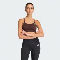 Biustonosz Optime Essentials Workout Light Support. Białe biustonosze sportowe damskie Adidas, bez wzorów, z elastanu. Za 149.00 zł.