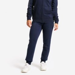 Spodnie dresowe Domyos Gym & Pilates slim. Niebieskie spodnie sportowe damskie DOMYOS, l, z dresówki, na fitness i siłownię. Za 99.99 zł.