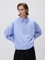 Krótka koszula - jasnoniebieski. Niebieskie koszule damskie Reserved, l, bez wzorów, z bawełny, bez kołnierzyka, bez ramiączek. Za 149.99 zł.
