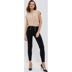 Legginsy z ozdobnym pasem. Czarne legginsy damskie MOODO, xs, bez wzorów, z elastanu. W wyprzedaży za 49.99 zł.