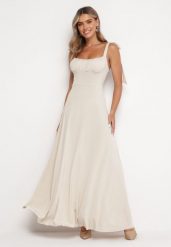 Jasnobeżowa Rozkloszowana Sukienka Maxi z Wiązanymi Ramiączkami Lisija. Brązowe sukienki damskie Born2be, m, bez wzorów, eleganckie, bez kołnierzyka, bez ramiączek, maxi, rozkloszowane. W wyprzedaży za 135.99 zł.