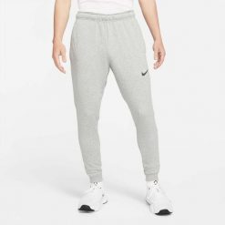 Spodnie sportowe męskie Nike Drifit Trapered. Czarne spodnie dresowe męskie Nike, bez wzorów, z dresówki. Za 358.00 zł.