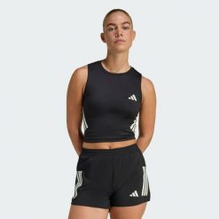 Koszulka adi365 Iconic Running Crop Tank. Czarne bluzki sportowe damskie Adidas, bez wzorów, bez kołnierzyka. Za 129.00 zł.