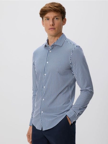 Koszula slim fit - granatowy. Niebieskie koszule męskie Reserved, l, bez wzorów, z dzianiny, bez kołnierzyka, bez ramiączek. Za 129.99 zł.