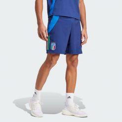 Szorty Italy Tiro 24 Competition Downtime. Niebieskie szorty męskie Adidas, z materiału, bez kołnierzyka. Za 208.10 zł.