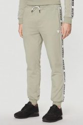GUESS Zielone męskie spodnie dresowe z lampasami New Arlo. Zielone spodnie dresowe męskie Guess, z aplikacjami, z dresówki. W wyprzedaży za 286.99 zł.