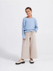 Koszulka z falbanką - jasnoniebieski. Niebieskie koszulki dziewczęce Reserved, bez wzorów, z dzianiny, bez ramiączek. W wyprzedaży za 22.99 zł.