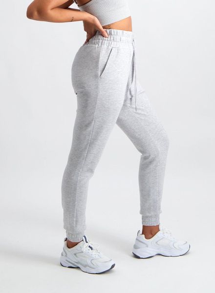 Damskie spodnie dresowe z modalem, wysoki stan, luźny krój Comfy jasnoszary. Szare spodnie sportowe damskie Aim'n, l, z dresówki, na fitness i siłownię. Za 219.70 zł.