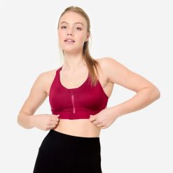 Stanik sportowy Decathlon zip. Fioletowe biustonosze sportowe damskie DOMYOS, bez wzorów, z elastanu. Za 119.99 zł.