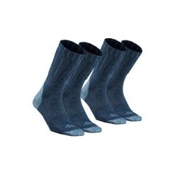 Skarpety turystyczne SH100 warm mid. Niebieskie skarpetki damskie QUECHUA, bez wzorów, z elastanu. Za 29.99 zł.
