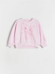 Bluza Lilo i Stitch - pastelowy róż. Czerwone bluzy i bluzki niemowlęce Reserved, bez wzorów, z bawełny, bez ramiączek, bez kaptura. W wyprzedaży za 27.99 zł.