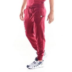 Spodnie męskie Leone 1947 Apparel. Czerwone spodnie sportowe męskie LEONE 1947 APPAREL, z tkaniny. W wyprzedaży za 120.40 zł.