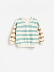 Bluza z bawełną - jasnoniebieski. Niebieskie bluzy i bluzki niemowlęce Reserved, bez wzorów, z bawełny, bez ramiączek, bez kaptura. Za 59.99 zł.