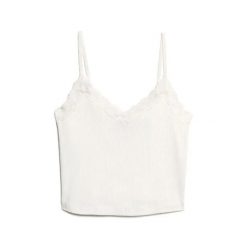 Krótki top z koronkowymi wykończeniami dla kobiet Superdry Athletic Essentials. Białe topy damskie Superdry., l, bez wzorów, z koronki, bez kołnierzyka. W wyprzedaży za 98.65 zł.