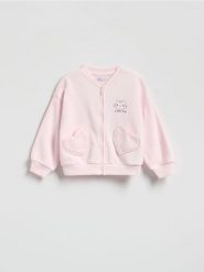 Bluza Koci Domek Gabi - pastelowy róż. Czerwone bluzy i bluzki niemowlęce Reserved, bez wzorów, z bawełny, bez ramiączek, bez kaptura. Za 59.99 zł.