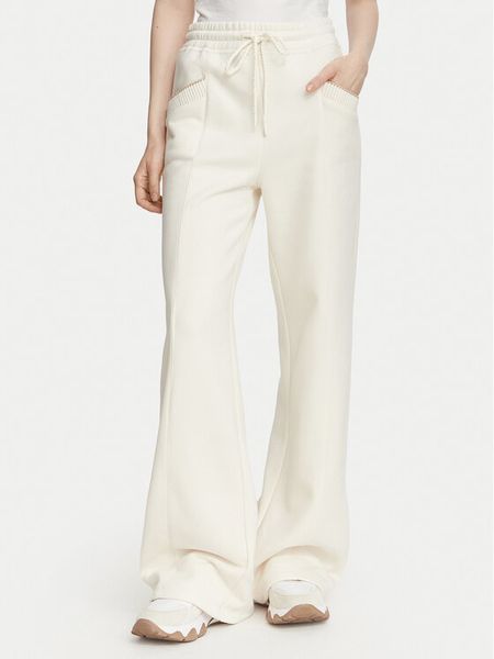 Guess Spodnie dresowe W6YB31 K5319 Kremowy Wide Leg. Białe spodnie dresowe damskie Guess, l, z aplikacjami, z bawełny. Za 412.99 zł.