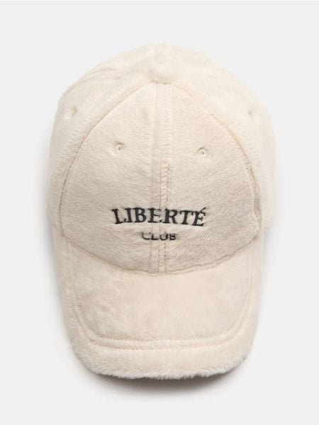 Czapka z daszkiem ze sztucznym futerkiem - kremowy. Białe czapki z daszkiem damskie Sinsay, bez wzorów. Za 25.99 zł.