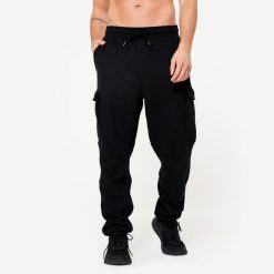 Spodnie dresowe męskie Domyos Gym & Pilates. Czarne spodnie dresowe męskie DOMYOS, z bawełny. Za 129.99 zł.