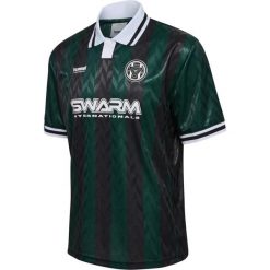 Koszulka Hummel Loose. Zielone bluzki damskie HUMMEL, bez wzorów, bez kołnierzyka, bez ramiączek. W wyprzedaży za 193.00 zł.