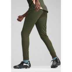 Męskie spodnie treningowe Manchester City PUMA Myrtle Bold Blue Green. Niebieskie spodnie dresowe męskie Puma, bez wzorów, z dresówki. W wyprzedaży za 207.50 zł.