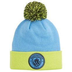 Młodzieżowa czapka beanie z pomponem Manchester City PUMA Magic Blue Yellow Glow. Niebieskia czapki zimowe damskie Puma. Za 142.99 zł.