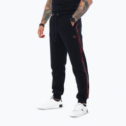 Spodnie męskie Octagon Stripe. Czarne spodnie materiałowe męskie OCTAGON, bez wzorów, z materiału. Za 219.99 zł.
