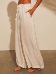 Milan Kiss Spodnie w kolorze kremowym rozmiar: M. Brązowe spodnie materiałowe damskie Milan Kiss, bez wzorów, z materiału. Za 152.99 zł.