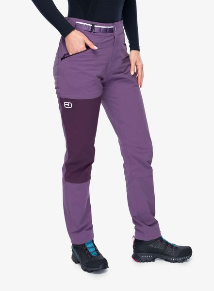 Spodnie damskie Ortovox Brenta Pants. Fioletowe spodnie materiałowe damskie ORTOVOX, bez wzorów, z materiału, z podwyższonym stanem. Za 585.99 zł.