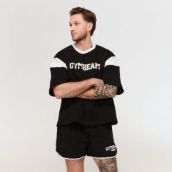 Szorty męskie fitness oversize ze sznurkiem Varsity czarne. Czarne szorty męskie GYMBEAM, l, z bawełny, na fitness i siłownię. Za 105.90 zł.