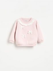 Bluza z aplikacją - pastelowy róż. Czerwone bluzy i bluzki niemowlęce Reserved, z aplikacjami, z bawełny, bez ramiączek, bez kaptura. Za 49.99 zł.