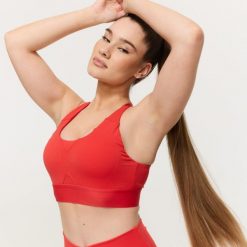 Stanik sportowy damski fitness z regulowanymi ramiączkami czerwony Limitless. Czerwone biustonosze sportowe damskie GYMBEAM, bez wzorów, z elastanu. Za 85.90 zł.