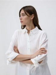 Muślinowa koszula - biały. Białe koszule damskie Reserved, l, bez wzorów, z bawełny, bez kołnierzyka, bez ramiączek. Za 109.99 zł.