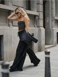 Szerokie spodnie z falbanami i wiązaniem w talii z wiskozą - czarny. Czarne spodnie materiałowe damskie Sinsay, bez wzorów, z wiskozy. Za 59.99 zł.