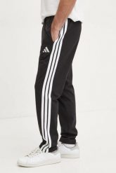 Spodnie dresowe adidas Essentials 3-Stripes Single. Czarne spodnie sportowe męskie Adidas, z dresówki. Za 197.20 zł.
