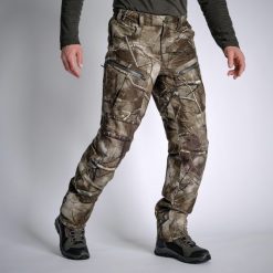 Spodnie myśliwskie Solognac Warm 900 camo treemetic wodoodporne. Brązowe spodnie materiałowe męskie SOLOGNAC, bez wzorów, z materiału, sportowe. Za 499.99 zł.