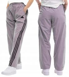Spodnie damskie adidas Future Icons Three Stripes Woven. Fioletowe spodnie sportowe damskie Adidas, m, z materiału, na fitness i siłownię. Za 229.99 zł.