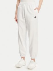 Calvin Klein Jeans Spodnie dresowe Monologo LV047B235G Biały Regular Fit. Białe jeansy damskie Calvin Klein Jeans, m, bez wzorów, z bawełny. Za 239.99 zł.